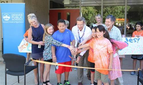 Supt. Tom Boasberg and Bromwell students cut ribbon for reopening 